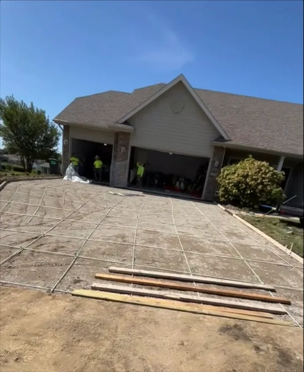 Forms and rebar in front of a three-car garage, Medina Concrete job